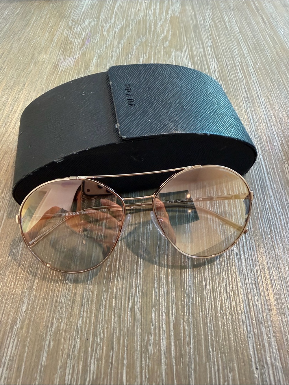 Prada women’s Aviator Sunglasses in Rose Gold Frame with Pink-Tinted Lenses